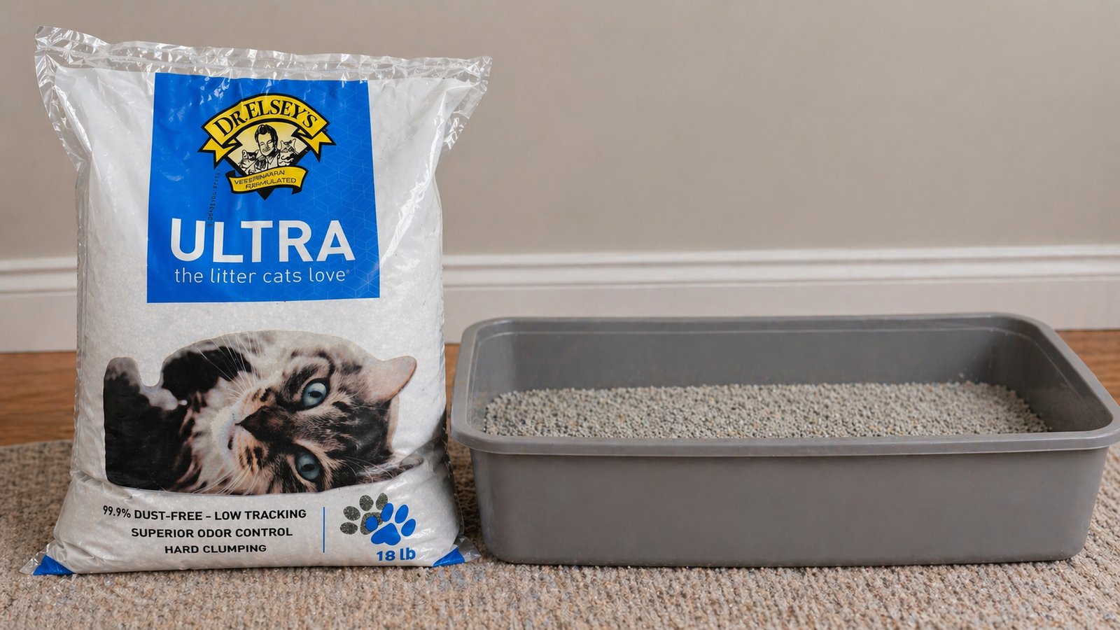 Dr. Elsey’s Ultra cat litter bag next to a large gray litter box filled with clumping litter